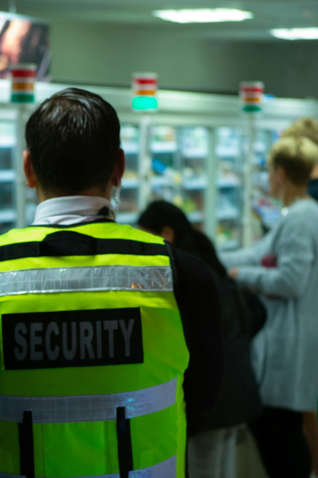 store security guard monitoring shoppers