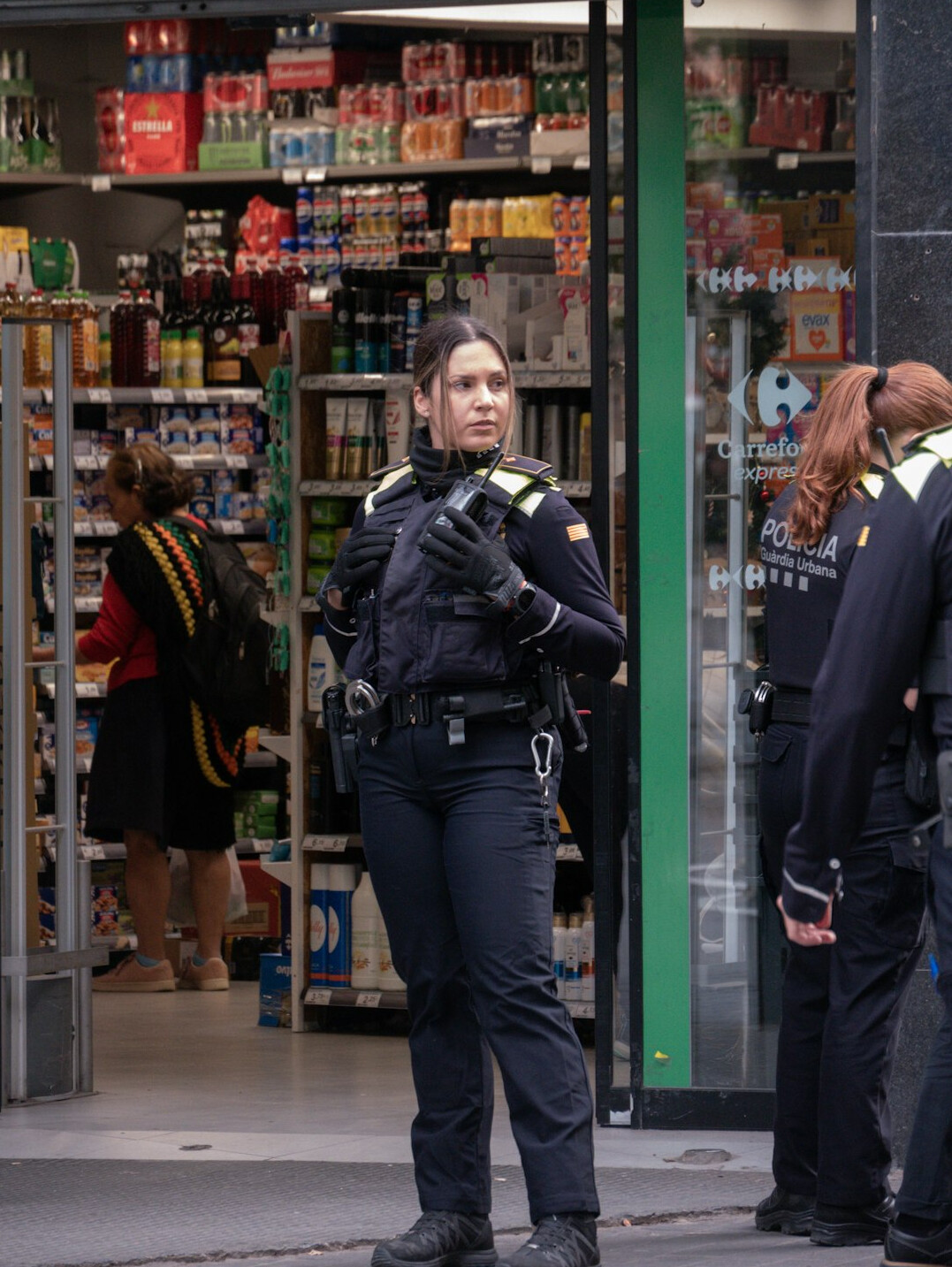 store detective monitoring customers