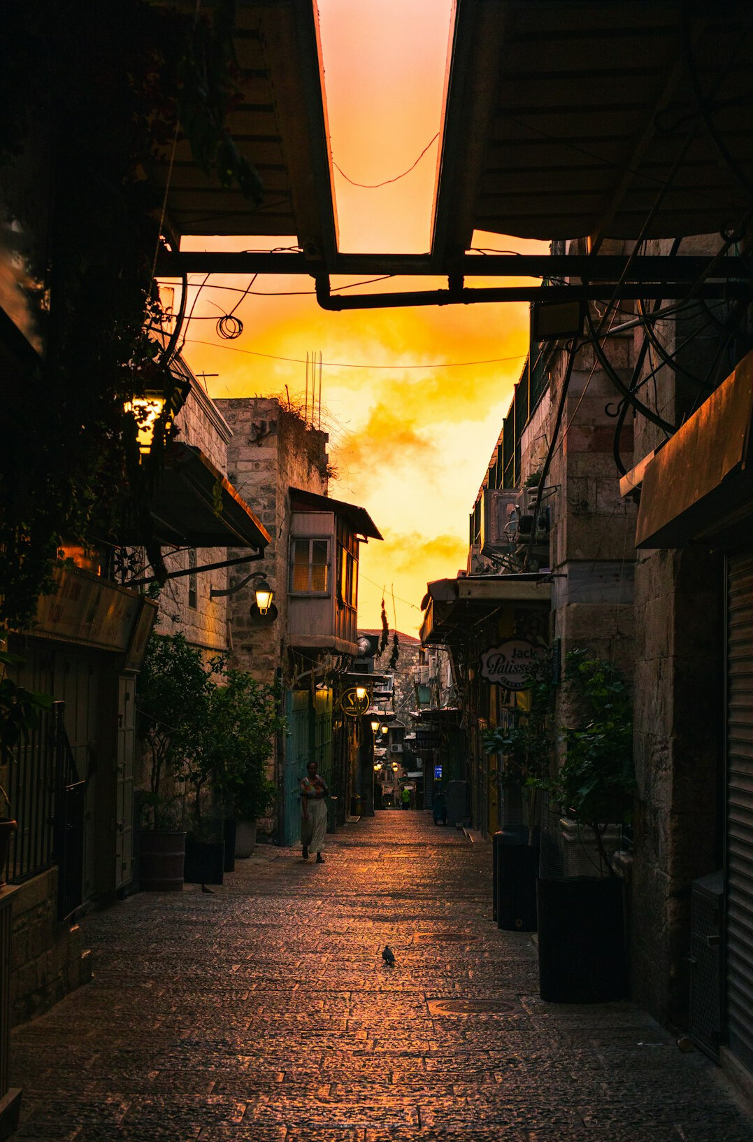 Old city street at dusk with warm lights