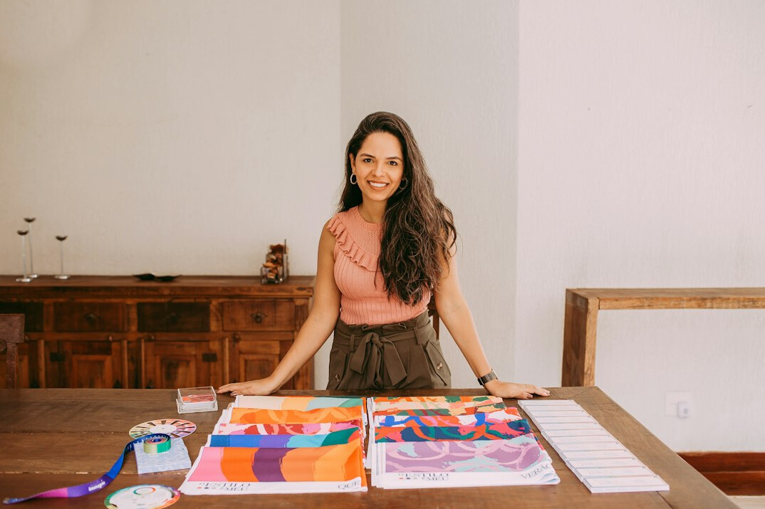 Portrait of a smiling Hispanic woman editor